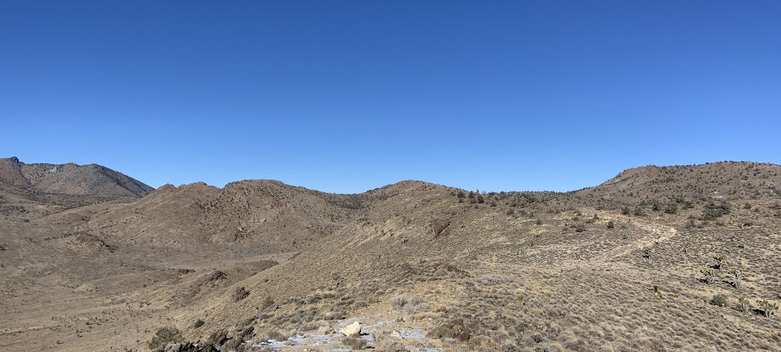 A company photograph shows terrain at the Mojave project in California.