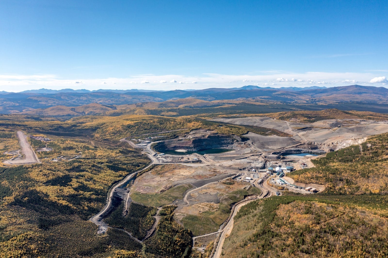 A wide photograph shows the Minto mine site in the Yukon landscape.