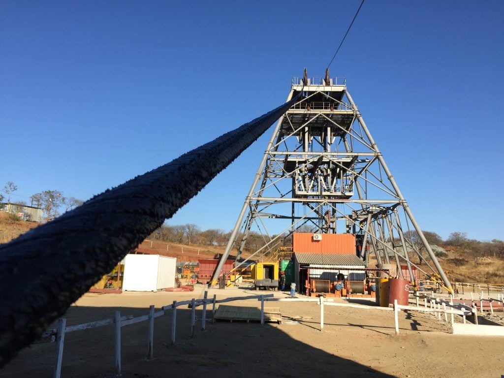 Mine winding equipment stands inside an industrial building.