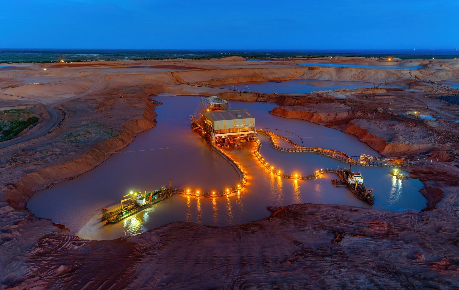 A photograph shows Kenmare's Moma titanium minerals mine in Mozambique.