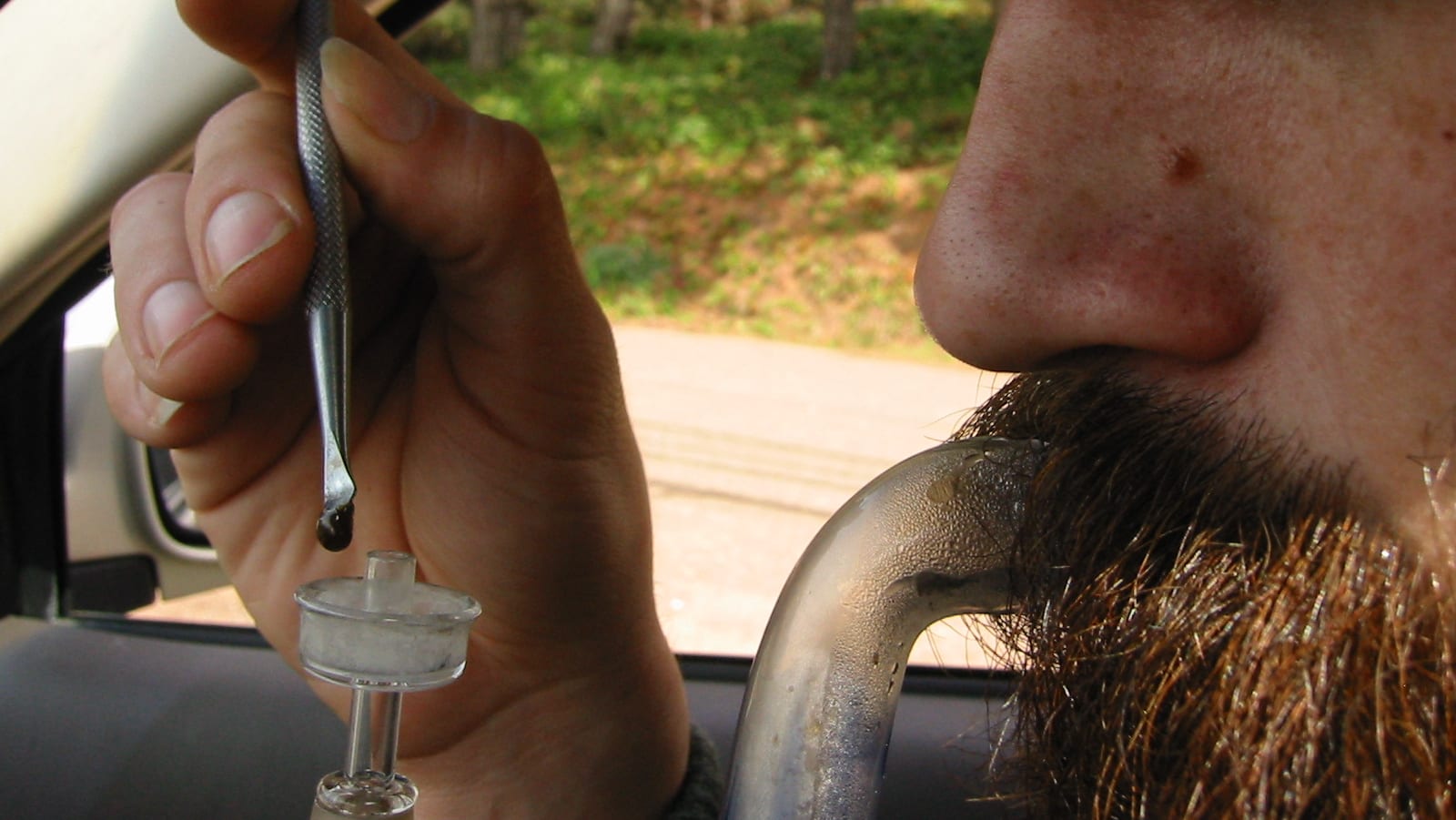 man dabbing cannabis in car: Majority of young Canadians think it’s safer to drive on cannabis than alcohol, CAA disagrees