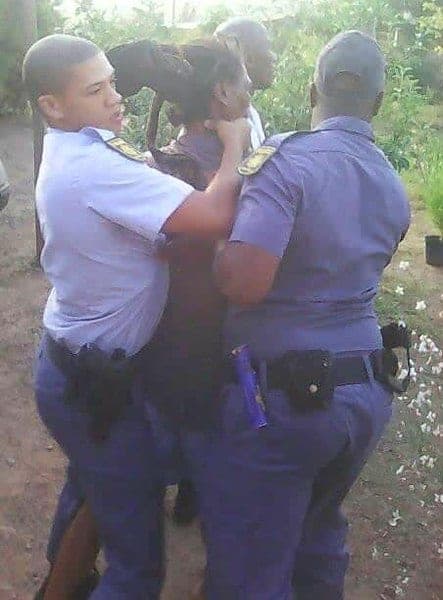 Police_arresting_Rastafarian_in_South_Africa