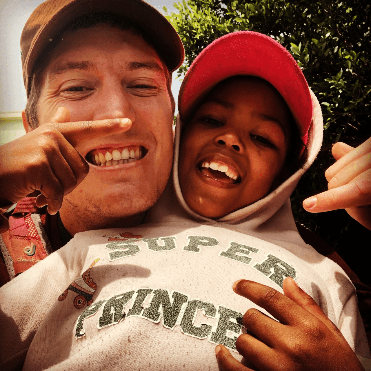 South Africa National Cannabis Master Plan.-MJ Stowe with one of SANPUD beneficiaries’ children, which was taken during outreach.