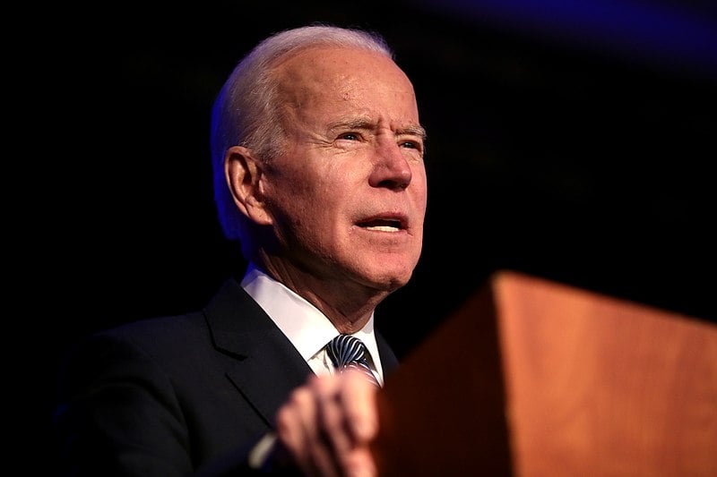 President Joe Biden speaking at a podium in 2020