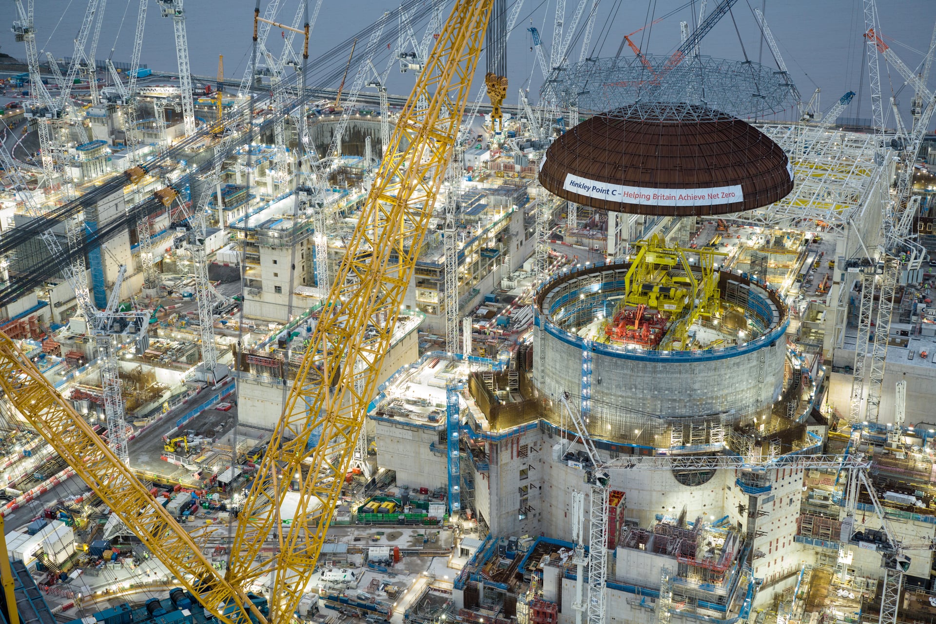 Massive lid hoisted onto future United Kingdom nuclear reactor housing