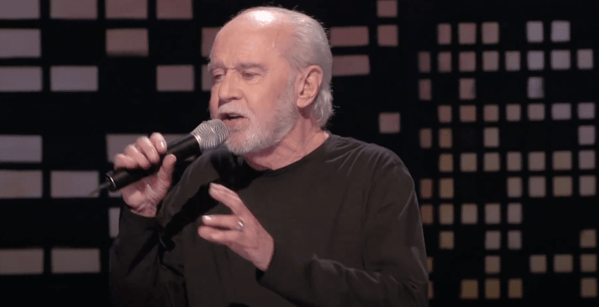 George Carlin's family sues podcasters over 'ghoulish' AI impression of late comedian
